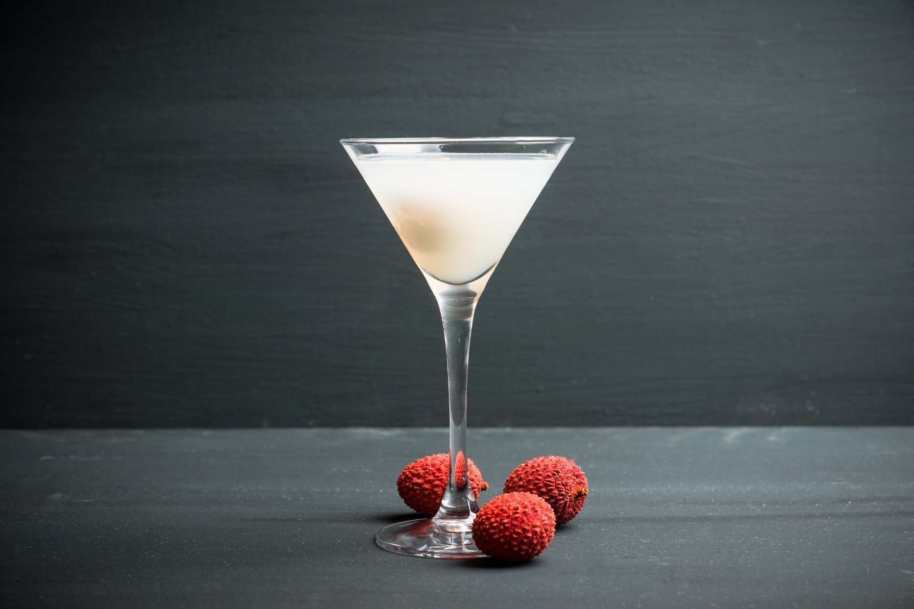 Sweet lychee martini on the rustic background